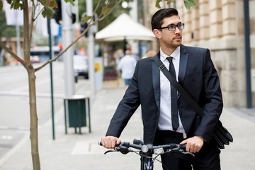 Young businessmen with a bike