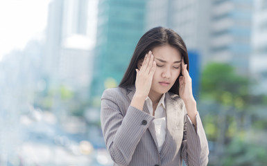 Portrait of Stressed business woman in the city.