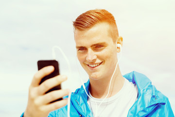 Sports and music. man getting ready for jogging