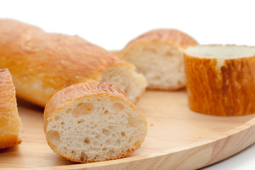 a slice of french bread on wooden plate