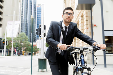 Young businessmen with a bike