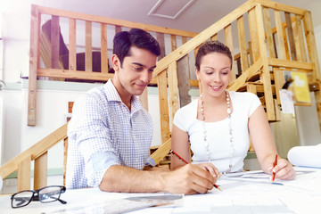 Obraz premium Two young architects in office