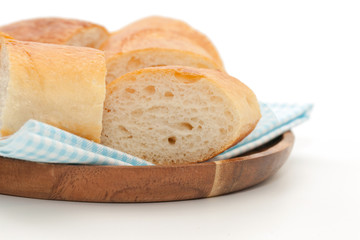 a slice of french bread on wooden plate