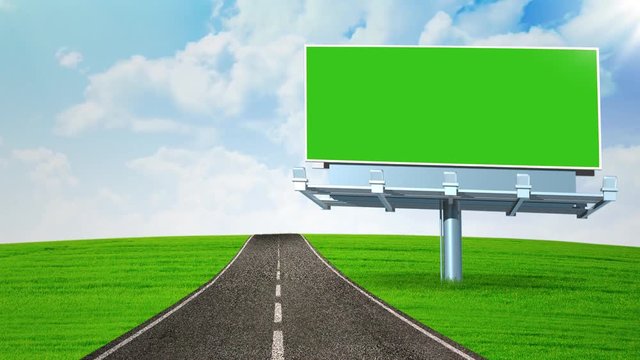 Timelapse footage of an empty billboard with green screen located near highway, shot outdoors with moving clouds on the sky