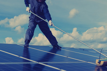 engineer working on checking and maintenance electrical equipment at solar power plant ;engineer...