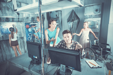 Family of five is using PC in time having fun together in lost labroom.