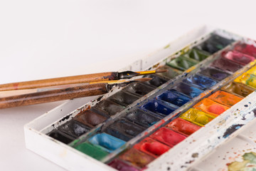 Image of paint buckets and brushes isolated