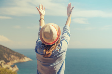 Girl enjoying the ocean and tropical view.