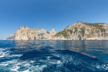 View from the boat on the cliff coast of Capri Island, Italy