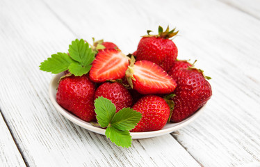 ripe strawberries on wooden table