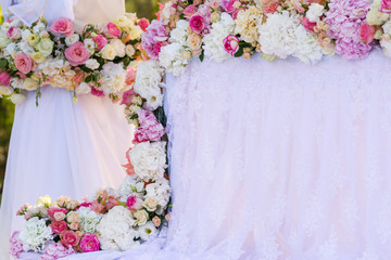 floral wedding decorations pink and white. Garland, candle, lace, bouquet