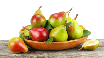 pear with leaf on old wooden table with white background