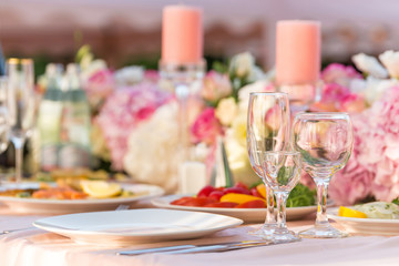 floral wedding decorations pink and white. Garland, candle, lace, bouquet