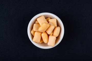 Colored chewing gum in a bowl