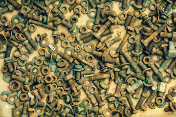 Abstract grunge metallic background from bolts, screws, nuts