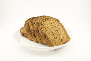 Black bread laid out on a plate