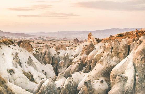 Natural valley with volcanic tuff stone rocks in Goreme in Cappadocia, Central Anatolia region of Turkey, at sunset