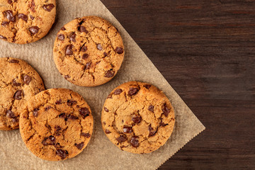 Chocolate chips cookies on baking paper with copyspace