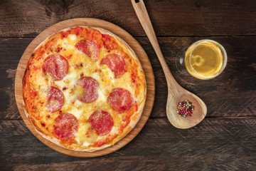 Pepperoni pizza with white wine, peppercorns, and copyspace