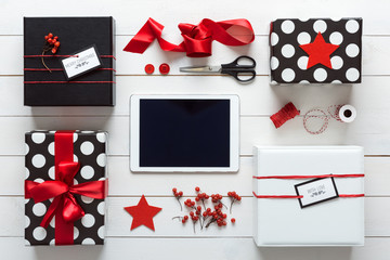 Elegant nordic retro christmas, wrapping station, desk view from above, online shopping concept