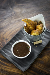 fried potato wedges with gravy sauce bar snack food