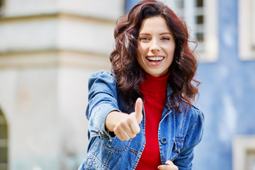 smiling girl shows okay. Denim girl