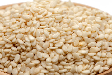 white Sesame on wood spoon on white background