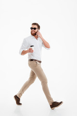 Handsome young bearded man drinking coffee