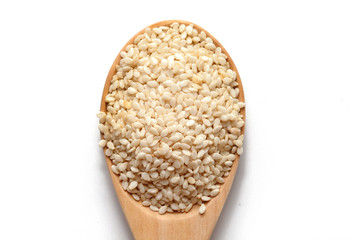 white Sesame on wood spoon on white background