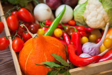 Fresh autumn vegetables in wooden box organic food top view