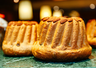 Two Alsace traditional Gugelhupf Kugelhopf with nuts in French bakery showcase in Aslace, France Strasbourg 