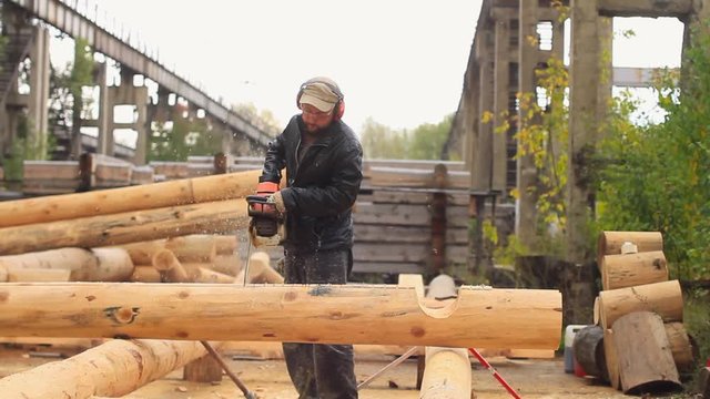 Saw sawing wood for home
