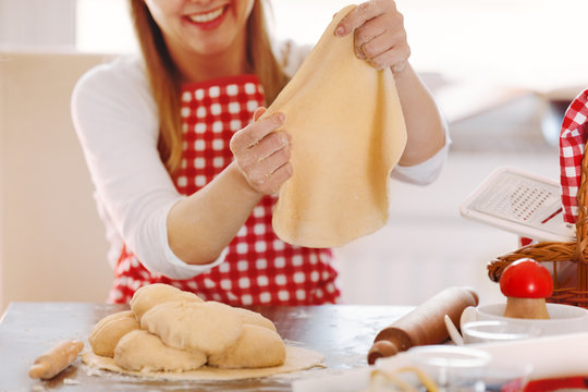 Woman Preparing Dough to Bake