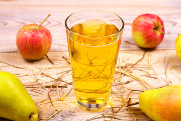 Glass of cider with apples and pears. Cider with fruits. Food and drink concept