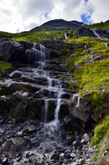 Naklejka na ściany i meble Scenic wild waterfall in Fjordlande (Hjorundfjord), Norway