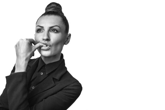  Beautiful stylish model in black suite sucks her big finger. Isolated on white background. 