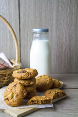 Cookies and milk are placed close together.