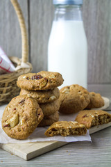 Cookies and milk are placed close together.