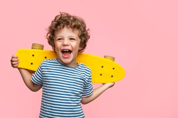 Fotobehang Cheerful boy with yellow longboard © kegfire