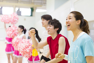 Students Cheering for the Team in Gymnasium