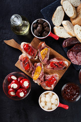 Spanish tapas with slices jamon serrano and grilled pepper. Also