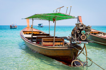 Long boat with engine and tropical beach, Andaman Sea, Thailand