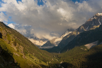 Fototapeta premium Russia, Republic of Kabardino-Balkaria, time lapse. Summer in the mountains of the Caucasus. Formation and movement of clouds over mountains peaks.