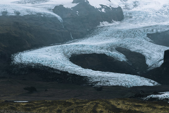 Glacier in Iceland between mountain range 