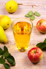 Glass of cider with apples and pears. Cider with fruits. Food and drink concept