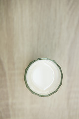 MILK GLASSES TOP VIEW
Top view a glass of milk on the wood top table. 
