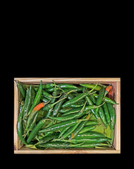 Green Cayenne Pepper in The Wooden Box on Black Background, Clipping Path