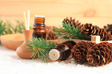 Fresh winter home scent. Medicinal amberglass dropper bottle with green fir-needle and cones, aromalamp diffuser for relaxing healthy spa. 