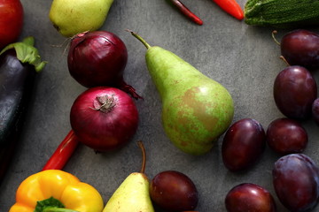 Naklejka na ściany i meble Autumn crops among fruits and vegetables.