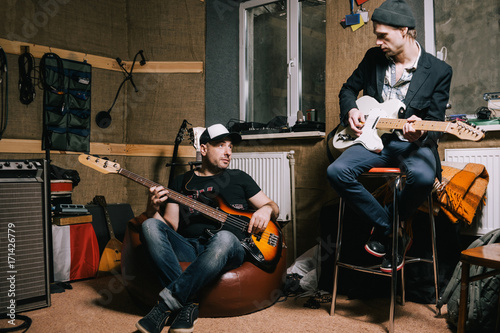 Band Of Adult Guitarists Rehearsing In Garage Grown Up Musicians